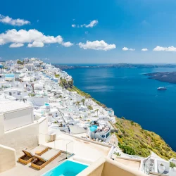 santorini-greece-beautiful-white-architecture-blue-sea-sky-beds-swimming-pool-caldera